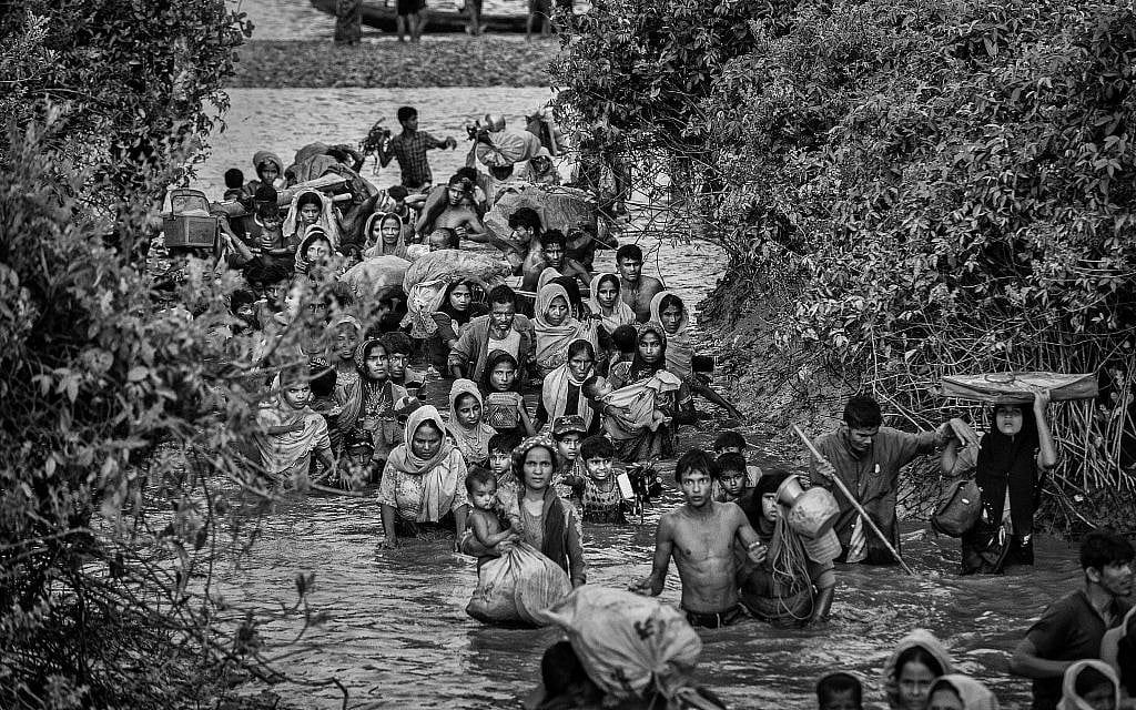 Rohingya Muslim refugees crowd a canal as they flee over the border from Myanmar into Bangladesh, November 1, 2017. (Kevin Frayer/Getty Images/via JTA) Rohingya Muslim refugees crowd a canal as they flee over the border from Myanmar into Bangladesh, November 1, 2017. (Kevin Frayer/Getty Images/via JTA)