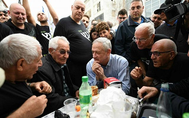 Israel Resilience party leader Benny Gantz, center, meets with residents of the Kochav Hatsafon neighborhood in Tel Aviv, February 1, 2019. (Sraya Diamant/Israel Resilience) Israel Resilience party leader Benny Gantz, center, meets with residents of the Kochav Hatsafon neighborhood in Tel Aviv, February 1, 2019. (Sraya Diamant/Israel Resilience)
