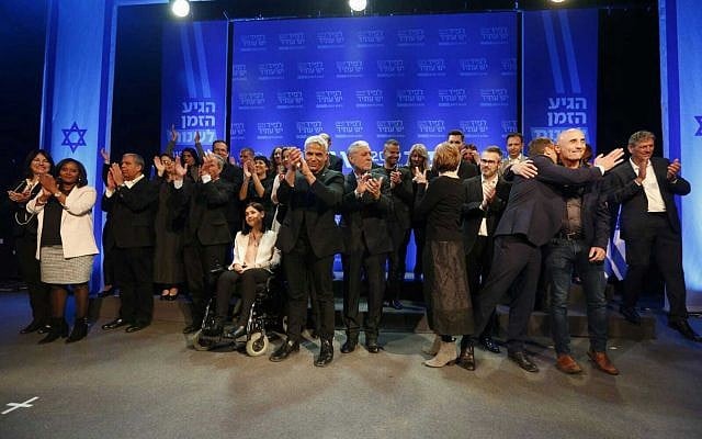 Members of Yesh Atid are seen on stage at an event in Kibbutz Shefayim where the party unveiled its list of candidates for upcoming Knesset elections, on February 8, 2019. (Adrian Sebal)