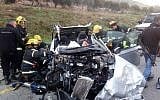 Firefighters at the scene of a deadly car crash in the central West Bank on February 19, 2019. (Israel Police)