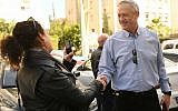 Israel Resilience's Benny Gantz speaking to a Times of Israel journalist while campaigning in Tel Aviv, February 1, 2019 (Sraya Diamant/Israel Resilience)