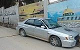 A car with slashed tires and spray painted Star of David found in the West Bank village of Ras Karkar, February 21, 2019. (Courtesy)
