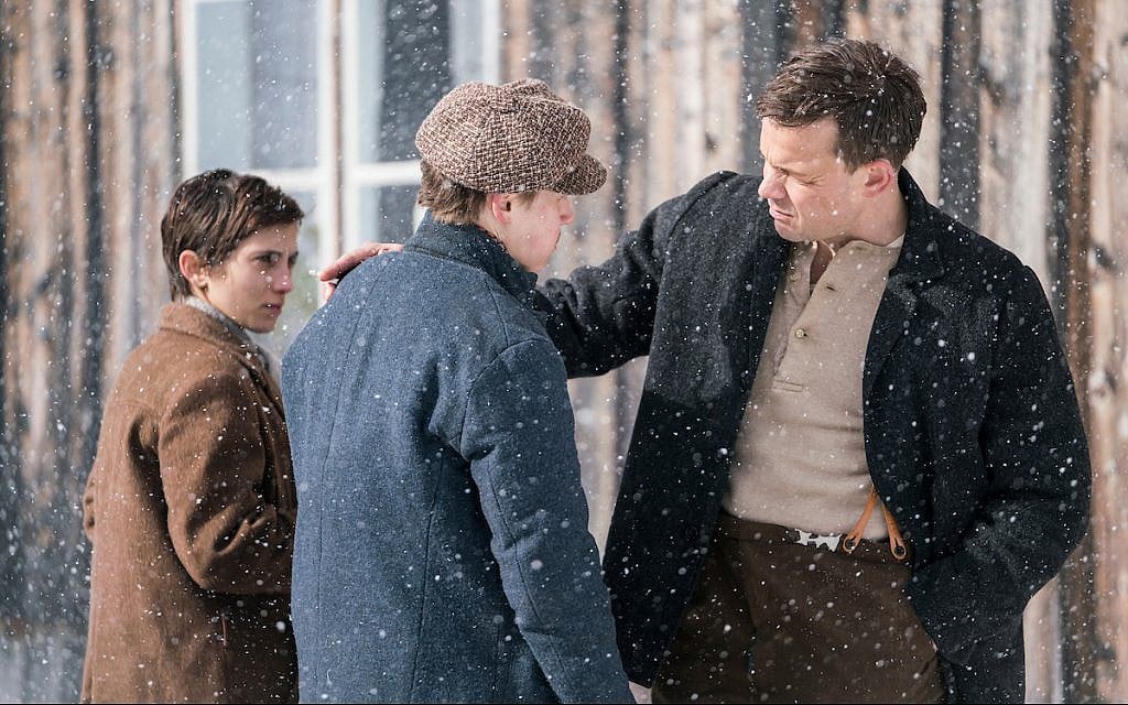 In the new historical dramatic film 'The Bird Catcher', a Norwegian Jewish girl named Esther (Sarah-Sofie Boussnina) poses as a non-Jewish boy named Ola to survive on a country farm with the Dalgaard family during WWII. Ola, at left, appears in a scene with two members of the family: Aksel (Arthur Hakalahti), center, who knows her secret; and Uncle Fred (Johannes Kuhnke), right. (Courtesy)