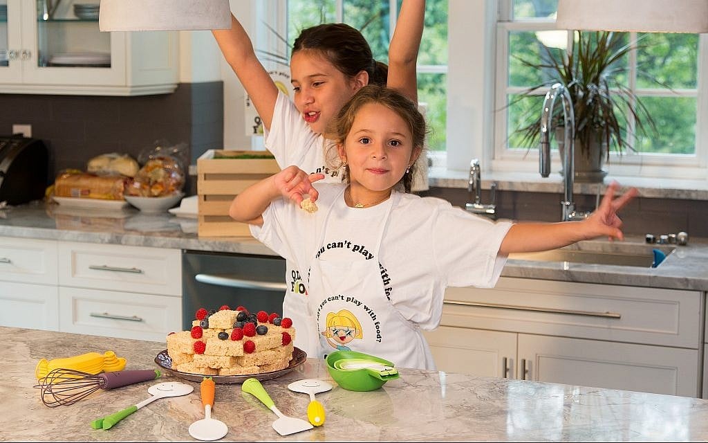 Kids cooking with Q.D. Foodie kitchen tools. (Courtesy Q.D. Foodie)