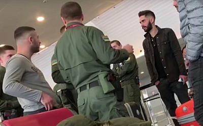 A group of detained Israelis speak with Ukrainian security guards at Kiev Boryspil International Airport on February 2018, 2019. (Screen capture: YouTube)