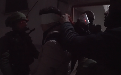 Israeli troops in the al-Aroub refugee camp in the central West Bank arrest a Palestinian suspect who is believed to have thrown rocks at a nearby highway, on February 20, 2019. (Screen capture: Israel Defense Forces)