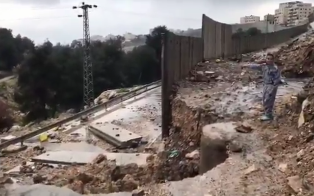 A section of the security barrier around the West Bank village of Anata near Jerusalem that collapsed after a rainstorm on February 27, 2019. (Screen capture) A section of the security barrier around the West Bank village of Anata near Jerusalem that collapsed after a rainstorm on February 27, 2019. (Screen capture)