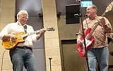US ambassador David Friedman and former Arkansas governor Mike Huckabee play Lynyrd Skynyrd in Jerusalem, February 12, 2019. (Facebook screenshot)