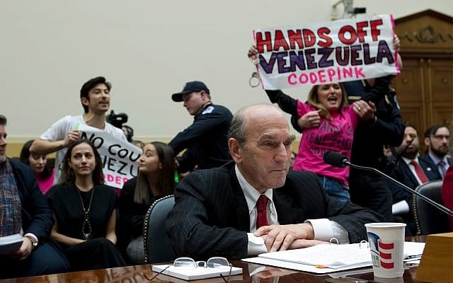 US Special Representative for Venezuela Elliott Abrams testifies as demonstrators protest behind him during the House Foreign Affairs subcommittee hearing on Venezuela at Capitol Hill in Washington, February 13, 2019. (AP Photo/Jose Luis Magana) US Special Representative for Venezuela Elliott Abrams testifies as demonstrators protest behind him during the House Foreign Affairs subcommittee hearing on Venezuela at Capitol Hill in Washington, February 13, 2019. (AP Photo/Jose Luis Magana)
