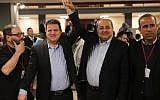 MKs Ayman Odeh and Ahmad Tibi react after submitting a joint list of candidates from their Hadash and Ta'al parties to the Central Elections Committee at the Knesset on February 21, 2019. (Hadash)