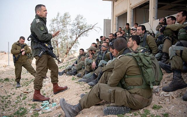 Chief of Staff Aviv Kohavi (2nd-L) speaks with soldiers taking part in a snap drill at the Tzeelim base in southern Israel simulating a future military conflict in the Gaza Strip, February 26, 2019. (Israel Defense Forces)