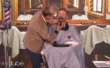Ellen Degeneres (L) shaves the beard of Julian Edelman of the New England Patriots  for charity (Screencapture/YouTube)