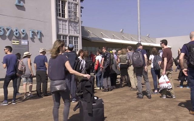 Israeli tourists visit the tower at Entebbe Airport where hostages were held captive in 1976, on February 14, 2019 (Screen grab via NTV) Israeli tourists visit the tower at Entebbe Airport where hostages were held captive in 1976, on February 14, 2019 (Screen grab via NTV)