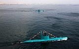 Iran's newly launched Ghadir submarines move in the southern port of Bandar Abbas in Persian Gulf, Iran, Wednesday, Nov. 28, 2012. Ghadir class submarines can fire missiles and torpedoes at the same time, and can operate in the Persian Gulf's shallow waters. (AP Photo/Fars News Agency, Ebrahim Norouzi)