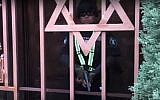 A guard seen outside a Jewish school and synagogue in Los Angeles before shooting the person filming the scene in the leg, on February 14, 2019. (screen capture: YouTube)
