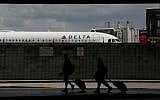 Travelers walk to their terminal at the Fort Lauderdale–Hollywood International Airport on June 29, 2018 (AP Photo/Brynn Anderson)