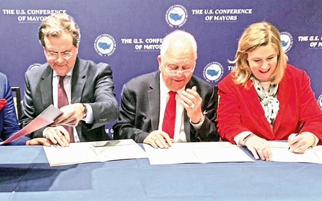 Signing the agreement on Jan. 24 between the American Jewish Committee and the US Conference of Mayors for AJC to host annual trips to Israel for US mayors (L to R): AJC CEO David Harris, Conference of Mayors CEO Tom Cochran, and Conference of Mayors International Committee Chair Nan Whaley, Mayor of Dayton. (US Conference of Mayors/ via Dayton Jewish Observer) Signing the agreement on Jan. 24 between the American Jewish Committee and the US Conference of Mayors for AJC to host annual trips to Israel for US mayors (L to R): AJC CEO David Harris, Conference of Mayors CEO Tom Cochran, and Conference of Mayors International Committee Chair Nan Whaley, Mayor of Dayton. (US Conference of Mayors/ via Dayton Jewish Observer)