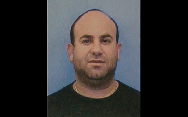 This image provided by the Dormont, Pennsylvania Police shows Moshe Journo, an Israeli man who allegedly had been on the run for 15 years after being accused of raping a teenage girl in Pennsylvania. Journo was remanded to the Allegheny County Jail after he was extradited back to United States on February 21, 2019. (Dormont Police/Pittsburgh Tribune-Review via AP) This image provided by the Dormont, Pennsylvania Police shows Moshe Journo, an Israeli man who allegedly had been on the run for 15 years after being accused of raping a teenage girl in Pennsylvania. Journo was remanded to the Allegheny County Jail after he was extradited back to United States on February 21, 2019. (Dormont Police/Pittsburgh Tribune-Review via AP)