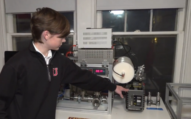 Jackson Oswalt shows his homemade fusion reactor to Fox News. (Fox News screenshot)