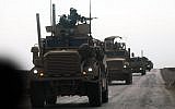 Military vehicles with the US-backed coalition against the Islamic State (IS) group during an operation to expel the jihadists, in the countryside of the eastern Syrian province of Deir Ezzor, February 21, 2019. (Delil Souleiman/AFP)
