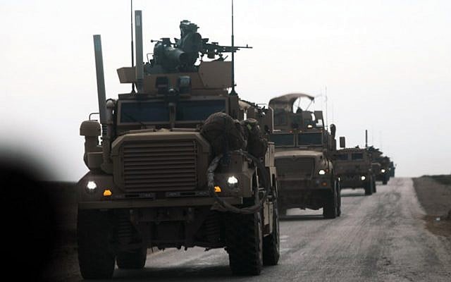 Military vehicles with the US-backed coalition against the Islamic State (IS) group during an operation to expel the jihadists, in the countryside of the eastern Syrian province of Deir Ezzor, February 21, 2019. (Delil Souleiman/AFP) Military vehicles with the US-backed coalition against the Islamic State (IS) group during an operation to expel the jihadists, in the countryside of the eastern Syrian province of Deir Ezzor, February 21, 2019. (Delil Souleiman/AFP)