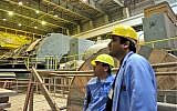 In this photo released by China's Xinhua News Agency, staff work in the turbine building of the Bushehr nuclear power plant near the southern Iranian port city of Bushehr, February 25, 2009. (AP Photo/Xinhua, Liang Youchang)
