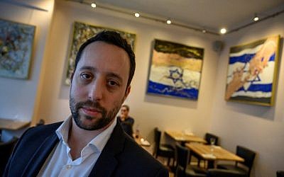 Israeli restaurateur Yorai Feinberg poses during an interview on February 26, 2019, at his restaurant in Berlin. (John MacDougall/AFP)