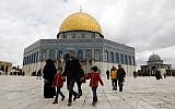 Palestinian Muslim worshipers walk past the Dome of the Rock mosque, situated in the al-Aqsa compound on the Temple Mount in Jerusalem's Old City, March 1, 2019, before Friday noon prayers. (Ahmad Gharabli/AFP)