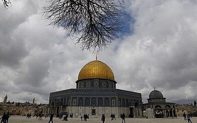 Palestinian Muslim worshipers walk past the Dome of the Rock mosque, situated in the al-Aqsa compound on the Temple Mount in Jerusalem's Old City, March 1, 2019, before Friday noon prayers. (Ahmad Gharabli/AFP)