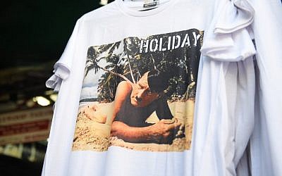 This photo taken on February 27, 2019, shows a t-shirt with a picture depicting a nude Adolf Hitler on a beach for sale at a street market for tourists in Bangkok. (Lillian SUWANRUMPHA / AFP)