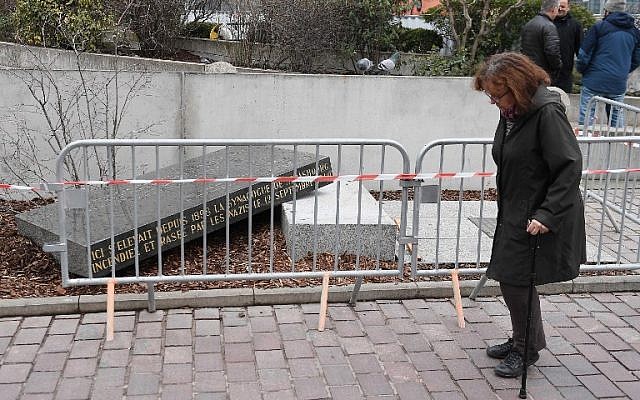 A person passes by the memorial stone marking the site of Strasbourg's Old Synagogue, which was destroyed by the Nazis in World War II, after it was vandalised overnight on March 2, 2019 in Strasbourg, eastern France. (FREDERICK FLORIN / AFP) A person passes by the memorial stone marking the site of Strasbourg's Old Synagogue, which was destroyed by the Nazis in World War II, after it was vandalised overnight on March 2, 2019 in Strasbourg, eastern France. (FREDERICK FLORIN / AFP)