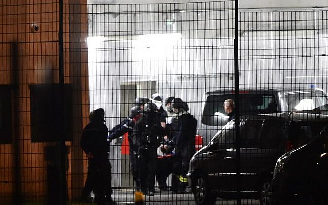 Security forces and emergency personnel carry an injured person on a stretcher at the Penitentiary center of Alencon, in Conde-sur-Sarthe, northwestern France, on March 5, 2019, where elite police units have been dispatched after a detainee seriously wounded two guards in a knife attack that justice officials said was being investigated as a terror incident. (Photo by JEAN-FRANCOIS MONIER / AFP) Security forces and emergency personnel carry an injured person on a stretcher at the Penitentiary center of Alencon, in Conde-sur-Sarthe, northwestern France, on March 5, 2019, where elite police units have been dispatched after a detainee seriously wounded two guards in a knife attack that justice officials said was being investigated as a terror incident. (Photo by JEAN-FRANCOIS MONIER / AFP)