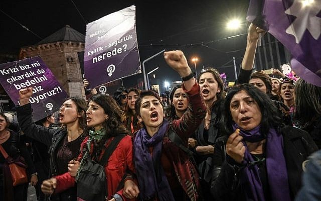 Women shout slogans as Turkish anti-riot police officers try to push them back during a rally marking International Women's Day on Istiklal avenue in Istanbul on March 8, 2019. (Ozan Kose/AFP) Women shout slogans as Turkish anti-riot police officers try to push them back during a rally marking International Women's Day on Istiklal avenue in Istanbul on March 8, 2019. (Ozan Kose/AFP)