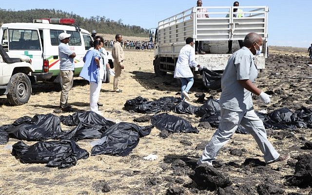 Rescue team walk past collected bodies in bags at the crash site of Ethiopia Airlines near Bishoftu, Ethiopia, on March 10, 2019. (Michael TEWELDE/AFP) Rescue team walk past collected bodies in bags at the crash site of Ethiopia Airlines near Bishoftu, Ethiopia, on March 10, 2019. (Michael TEWELDE/AFP)