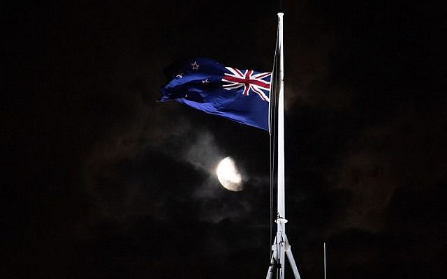 The New Zealand national flag is flown at half-mast on a Parliament building in Wellington on March 15, 2019, after a shooting incident in Christchurch. Attacks on two Christchurch mosques left at least 49 dead on March 15, with one gunman, identified as an Australian extremist, apparently livestreaming the assault that triggered the lockdown of the New Zealand city. (Marty Melville/AFP)