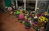 Flowers are placed on the front steps of the Wellington Masjid mosque in Kilbirnie in Wellington, on March 15, 2019, after a shooting attack at two mosques in Christchurch, New Zeland. (Marty Melville/AFP)