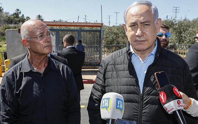 Ariel Mayor Eli Sheviro (L) stands next to Prime Minister Benjamin Netanyahu visits the site of a terror attack at Ariel Junction in the northern West Bank, March 18, 2019. (Jack Guez / POOL / AFP) Ariel Mayor Eli Sheviro (L) stands next to Prime Minister Benjamin Netanyahu visits the site of a terror attack at Ariel Junction in the northern West Bank, March 18, 2019. (Jack Guez / POOL / AFP)