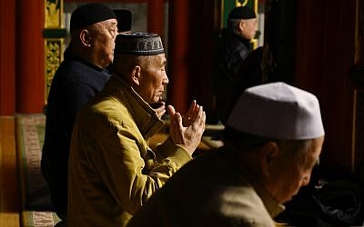 This photo taken on March 18, 2019 shows Muslim men praying at a mosque in Beijing. (GREG BAKER / AFP)