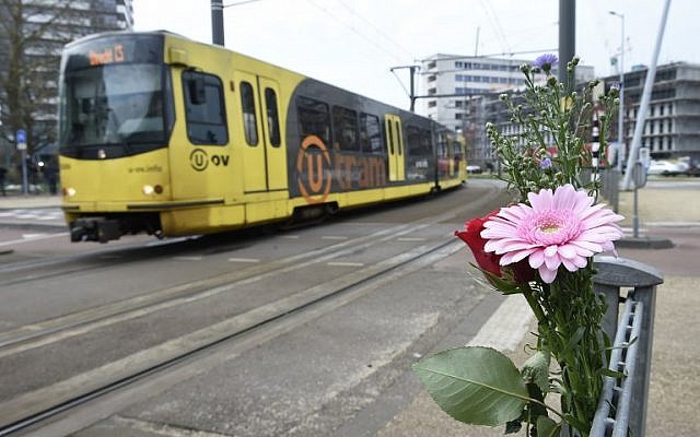 Flowers have been set up in tribute to victims at the site of a shooting in a tram, at 24 October square in Utrecht, on March 19, 2019, one day after three people were shot dead and several were injured in the attack. (Photo by JOHN THYS / AFP) Flowers have been set up in tribute to victims at the site of a shooting in a tram, at 24 October square in Utrecht, on March 19, 2019, one day after three people were shot dead and several were injured in the attack. (Photo by JOHN THYS / AFP)