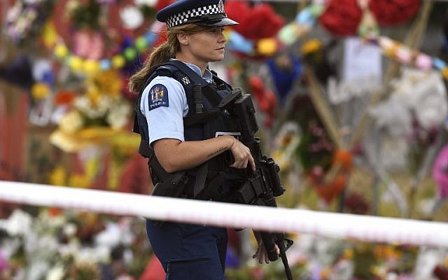 A policewoman patrols past a memorial wall outside the Linwood Mosque in Christchurch on March 21, 2019. (WILLIAM WEST / AFP) A policewoman patrols past a memorial wall outside the Linwood Mosque in Christchurch on March 21, 2019. (WILLIAM WEST / AFP)