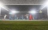 Slovenia's goalkeeper Jab Oblak concedes a goal to Israel's Eran Zahavi during the Euro 2020 Group G football qualification match between Israel and Slovenia at Sammy Ofer Stadium in Haifa on March 21, 2019. (Jack GUEZ / AFP)