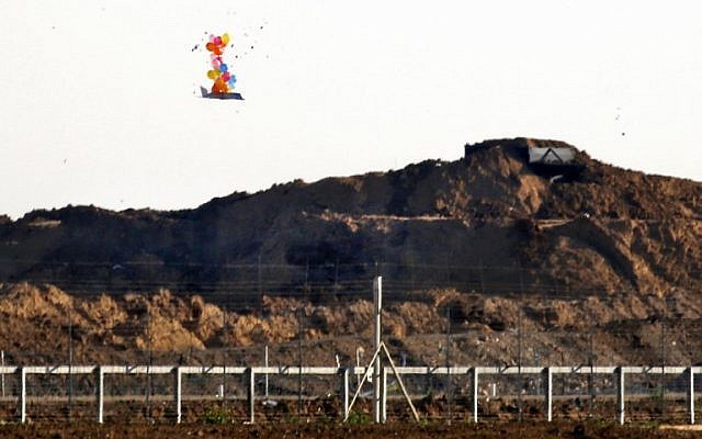 This picture from March 22, 2019, shows balloons carrying a make-shift drone-shaped object flying over the border with Israel east of Gaza City, after it was launched by Palestinians during clashes along the security fence. (Said Khatib/AFP) This picture from March 22, 2019, shows balloons carrying a make-shift drone-shaped object flying over the border with Israel east of Gaza City, after it was launched by Palestinians during clashes along the security fence. (Said Khatib/AFP)