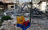 A damaged house after it was hit by a rocket in the village of Mishmeret, north of Tel Aviv on March 25, 2019. (Jack GUEZ/AFP)