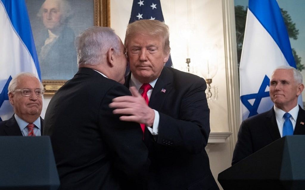 US President Donald Trump (R) and Prime Minister Benjamin Netanyahu embrace prior to signing a Proclamation on the Golan Heights in the Diplomatic Reception Room at the White House, March 25, 2019. (Saul Loeb/AFP) US President Donald Trump (R) and Prime Minister Benjamin Netanyahu embrace prior to signing a Proclamation on the Golan Heights in the Diplomatic Reception Room at the White House, March 25, 2019. (Saul Loeb/AFP)