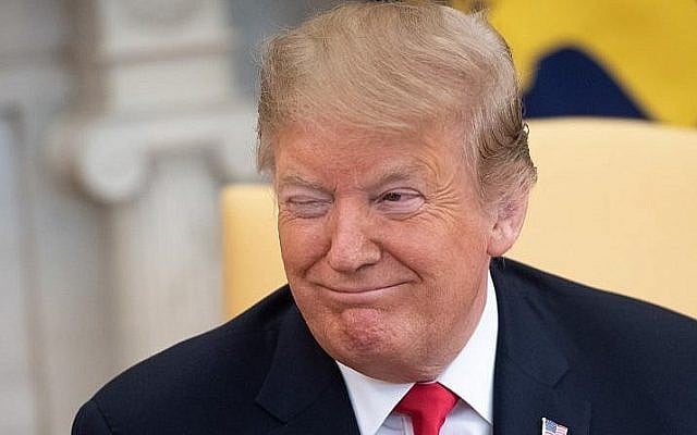 US President Donald Trump winks during a meeting with Prime Minister Benjamin Netanyahu in the Oval Office at the White House in Washington, DC, March 25, 2019 (Photo by SAUL LOEB / AFP) US President Donald Trump winks during a meeting with Prime Minister Benjamin Netanyahu in the Oval Office at the White House in Washington, DC, March 25, 2019 (Photo by SAUL LOEB / AFP)