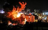 A ball of fire bellows above buildings in Gaza City during Israeli strikes on March 25, 2019. (Mahmud Hams/AFP)