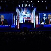 Prime Minister Benjamin Netanyahu speaks from Israel via video link at the annual AIPAC conference in Washington, on March 26, 2019. (Jim Watson/AFP/File)