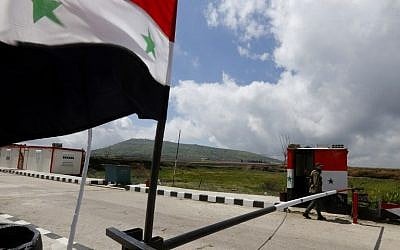 A member of the Syrian security forces walks near the border post with Israel in the Syrian town of Quneitra in the Golan Heights on March 26, 2019. (Louai Beshara/AFP) A member of the Syrian security forces walks near the border post with Israel in the Syrian town of Quneitra in the Golan Heights on March 26, 2019. (Louai Beshara/AFP)