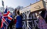 Pro-Brexit demonstrators carry a coffin representing the death of democracy as protesters gather in Parliament Square in central London on March 29, 2019. (Niklas Halle'n/AFP)