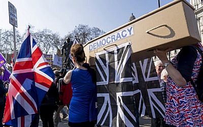 Pro-Brexit demonstrators carry a coffin representing the death of democracy as protesters gather in Parliament Square in central London on March 29, 2019. (Niklas Halle'n/AFP)